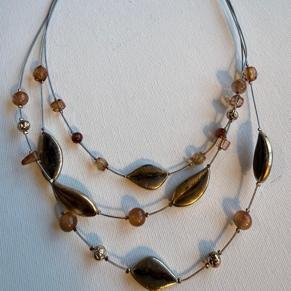 Brownish and gold beaded wire triple strand necklace with leaf shaped beads
